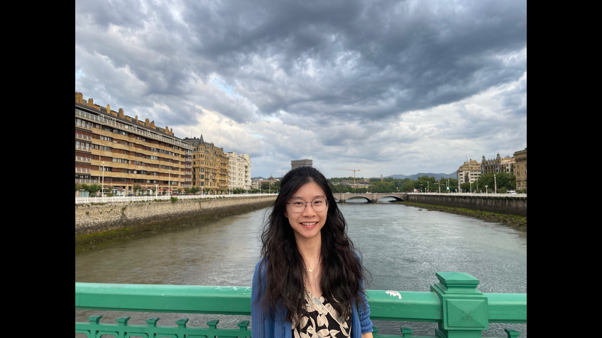 sla student poses in front of the canal
