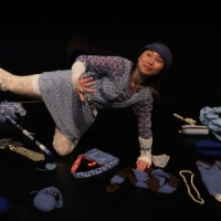 Jamie Chen poses with clothing pieces from her dance performance "hard work doesn’t work."